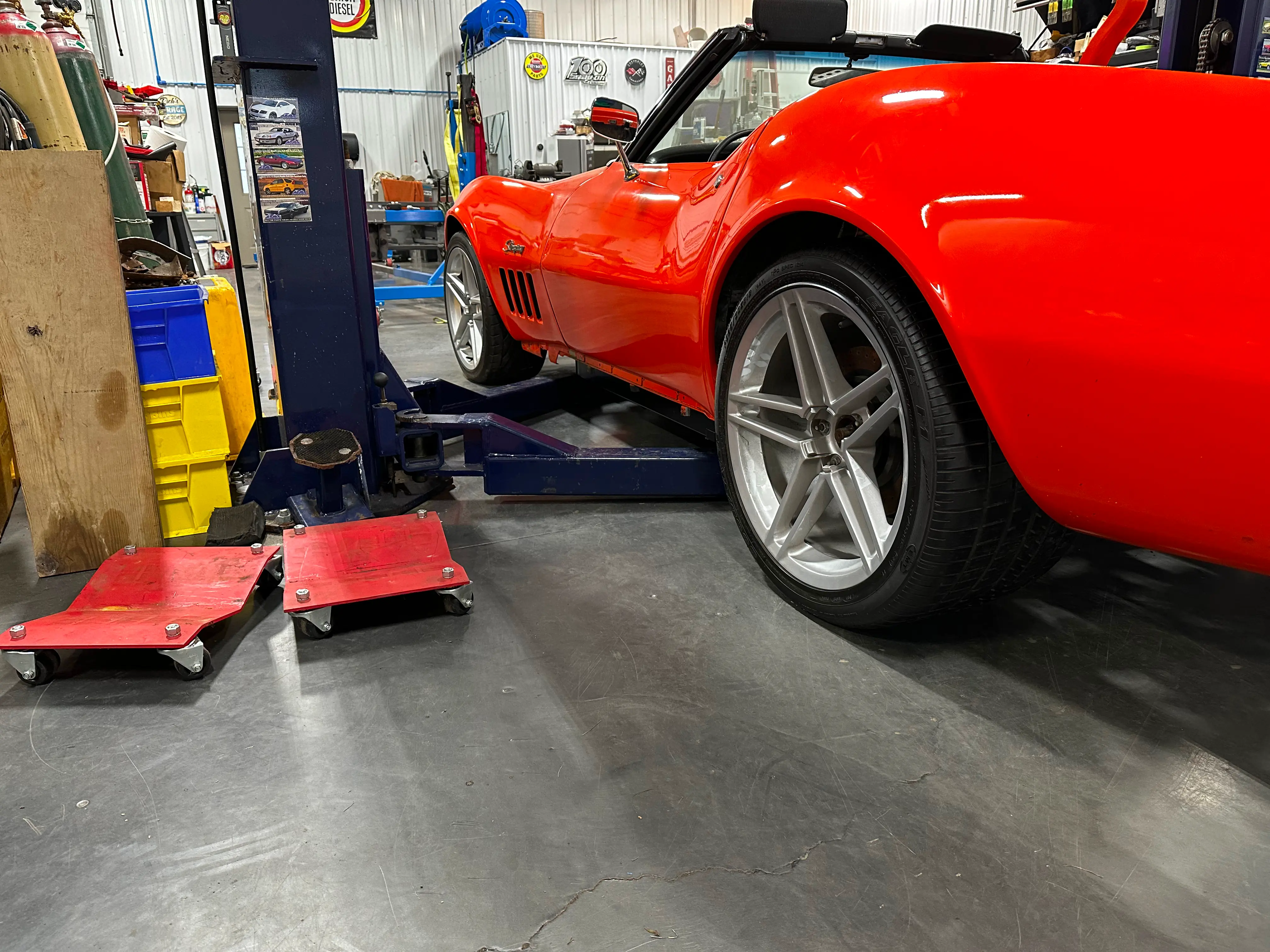 The body sitting on the new chassis on the ground