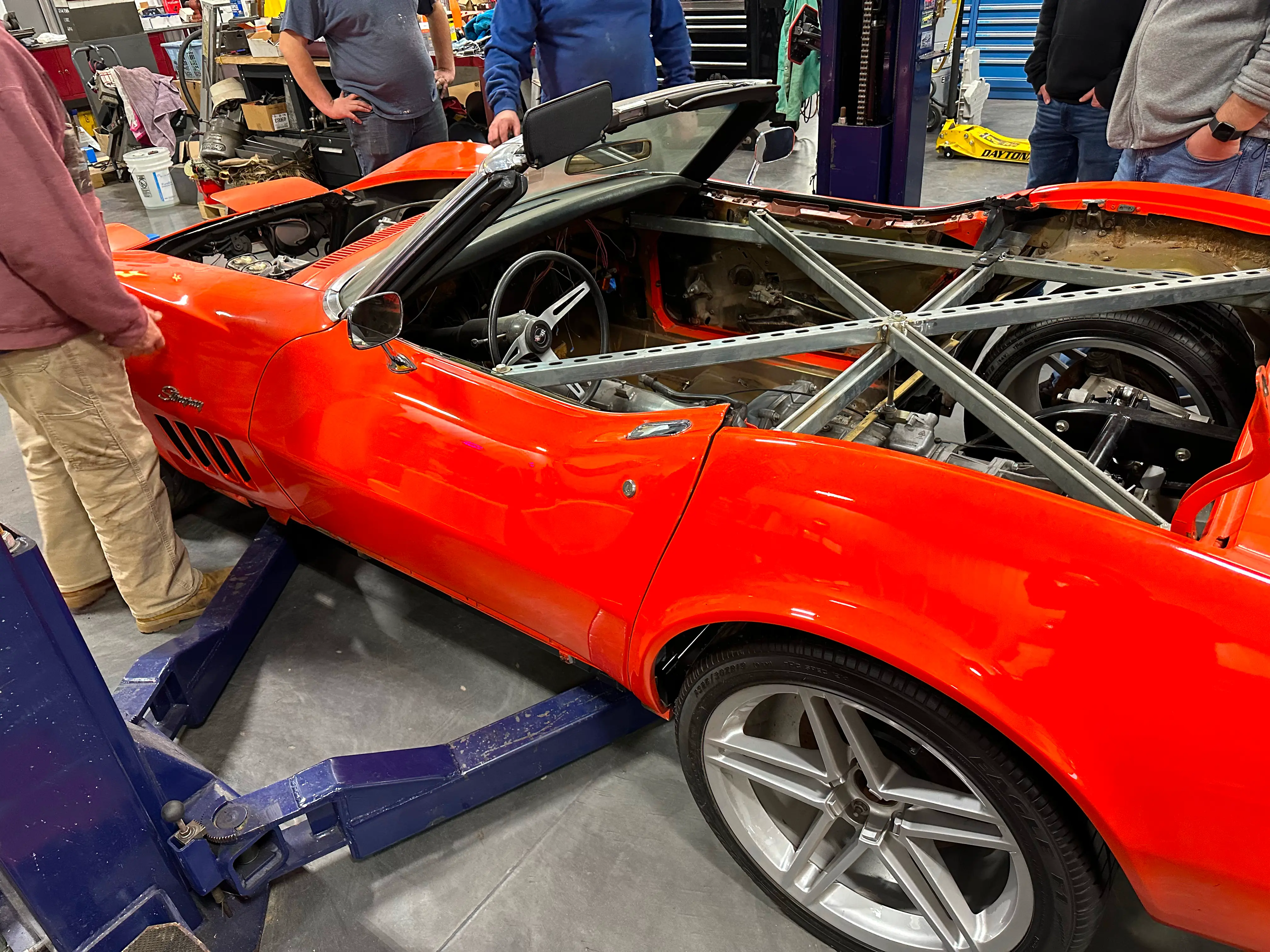 The body sitting on the new chassis on the ground