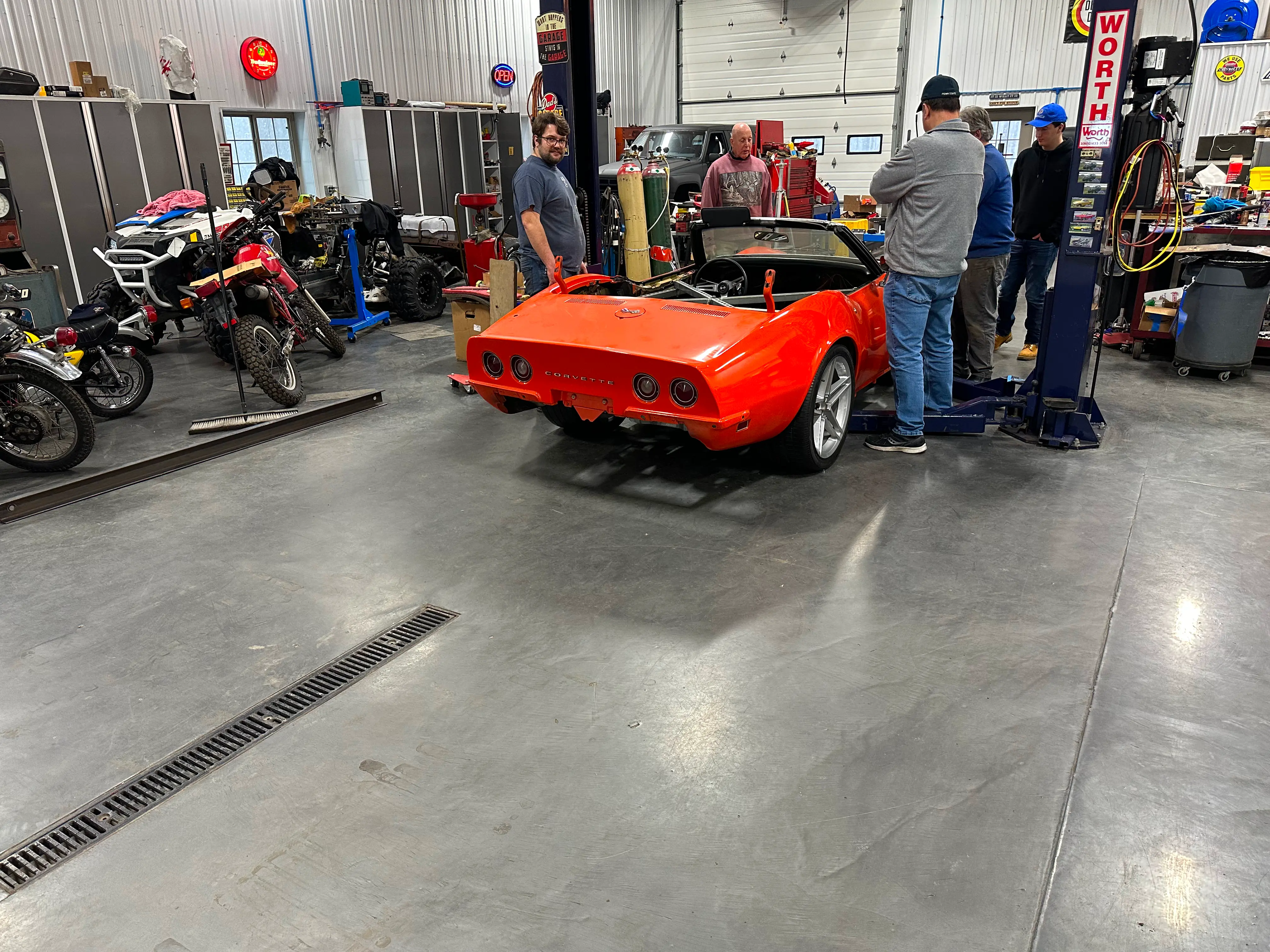 The body sitting on the new chassis on the ground