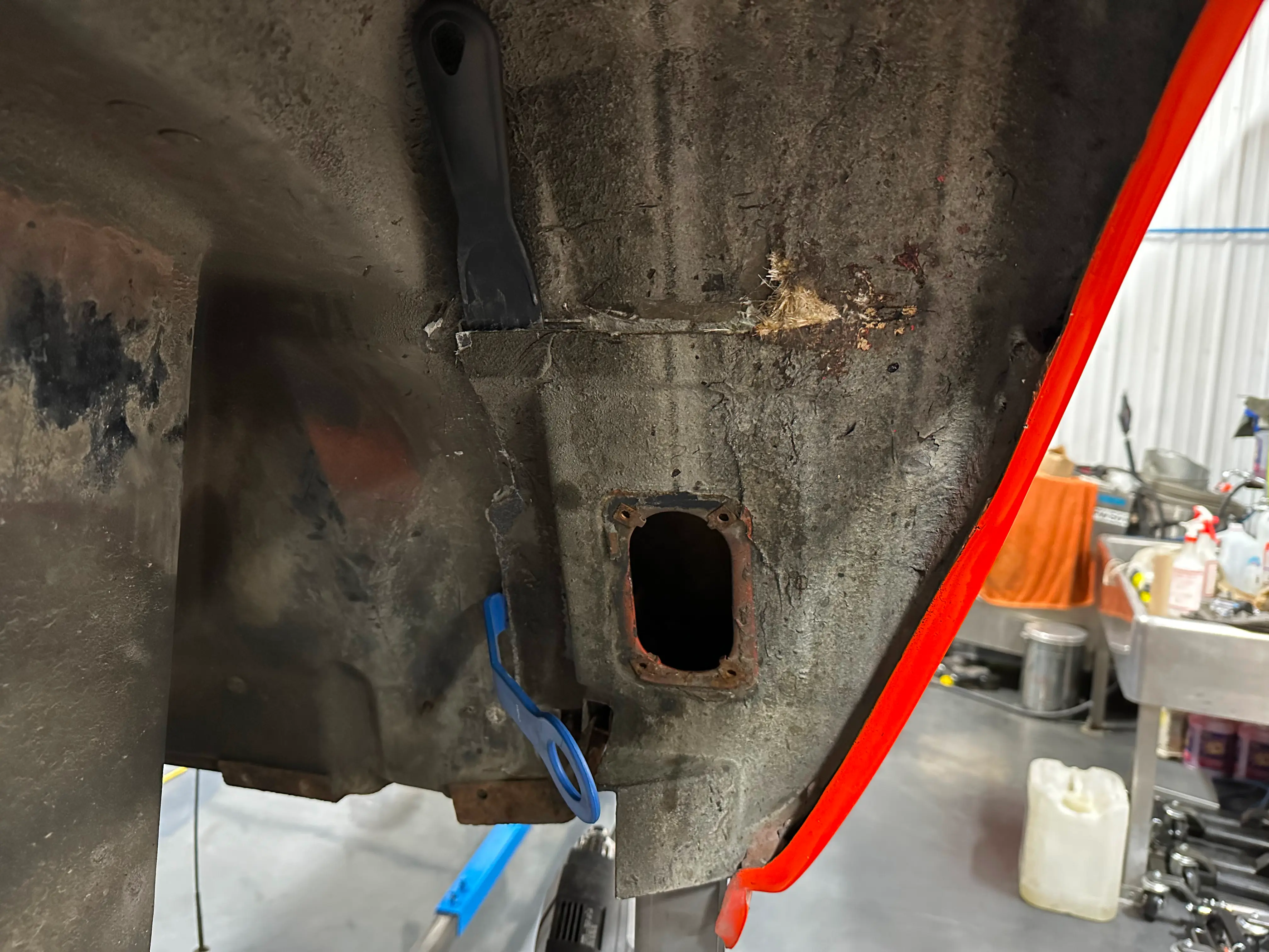 Cutting the fiberglass to access the number 3 mount